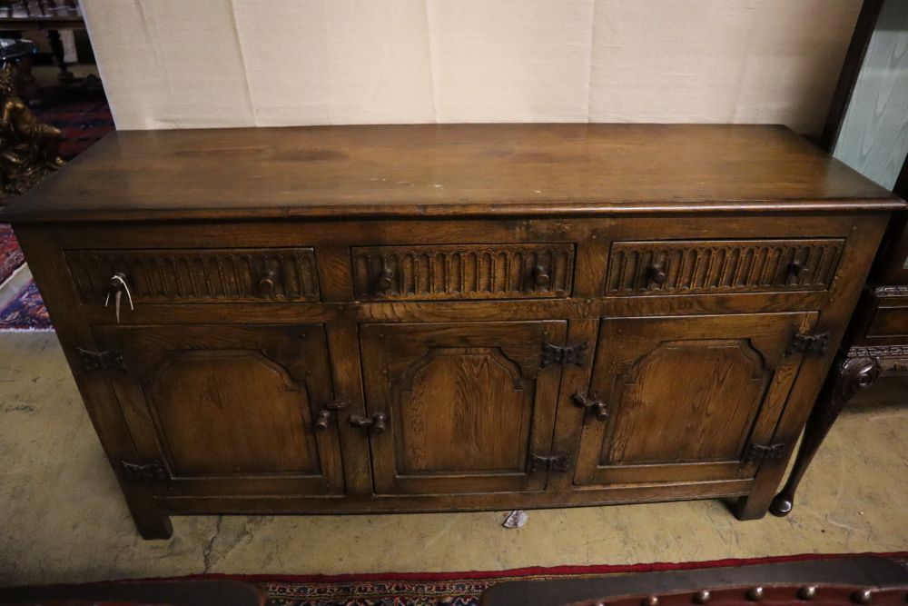 An 18th century-style oak refectory dining table, sideboard and four chairs, table 182 x 79cm height 76cm